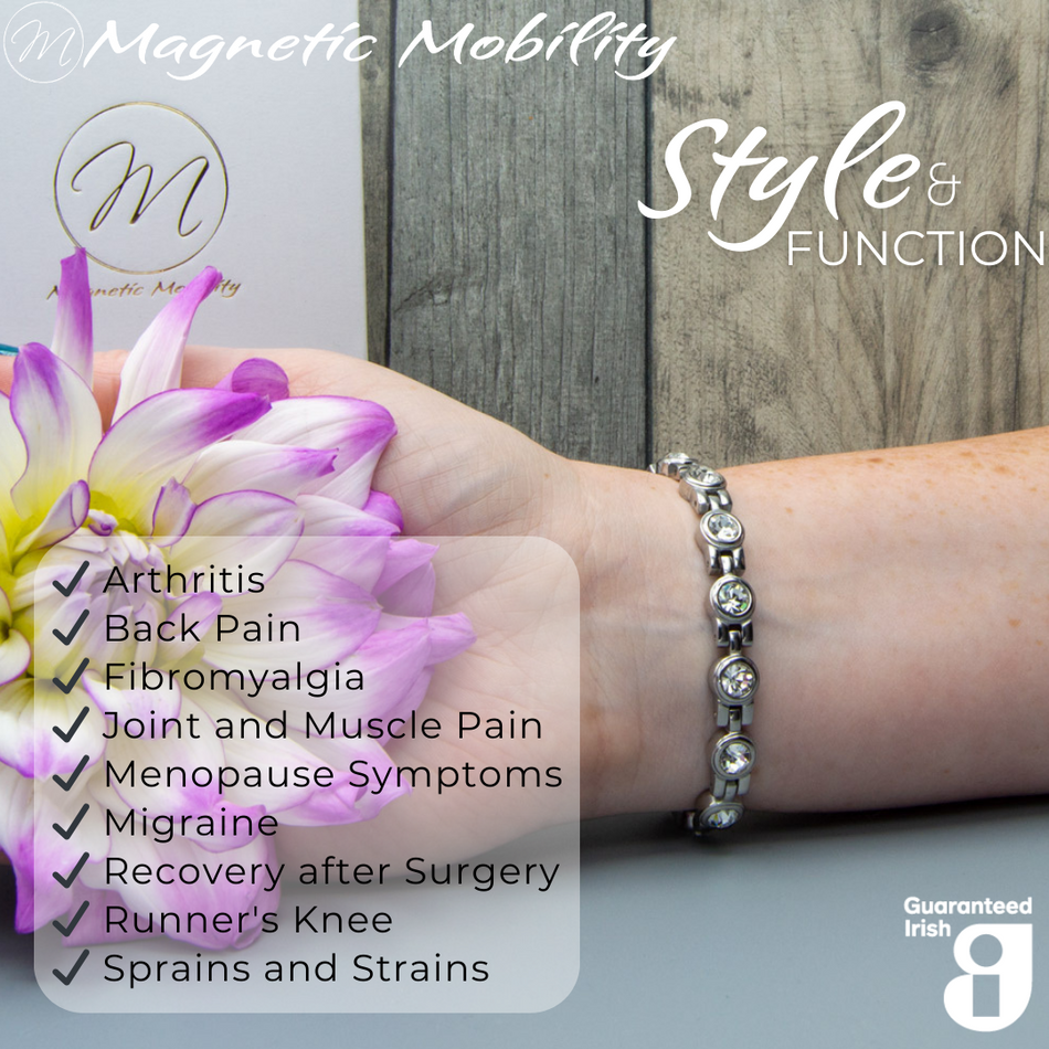 Close-up of Angelica's Star 4in1 Magnetic Bracelet from Magnetic Mobility, emphasizing Swarovski crystals and silver links. Text on image: 'Designed for people with Arthritis, Back Pain, Fibromyalgia, Joint and Muscle Pain, Menopause Symptoms, Migraine, Recovery after Surgery, Runner's Knee, Sprains and Strains.' Promotes style and function with Guaranteed Irish quality.
